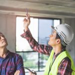 Client and Contractor discussing plan to renovation house.