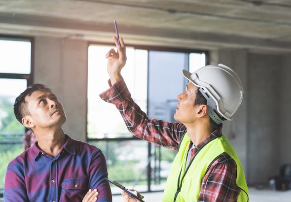 Client and Contractor discussing plan to renovation house.